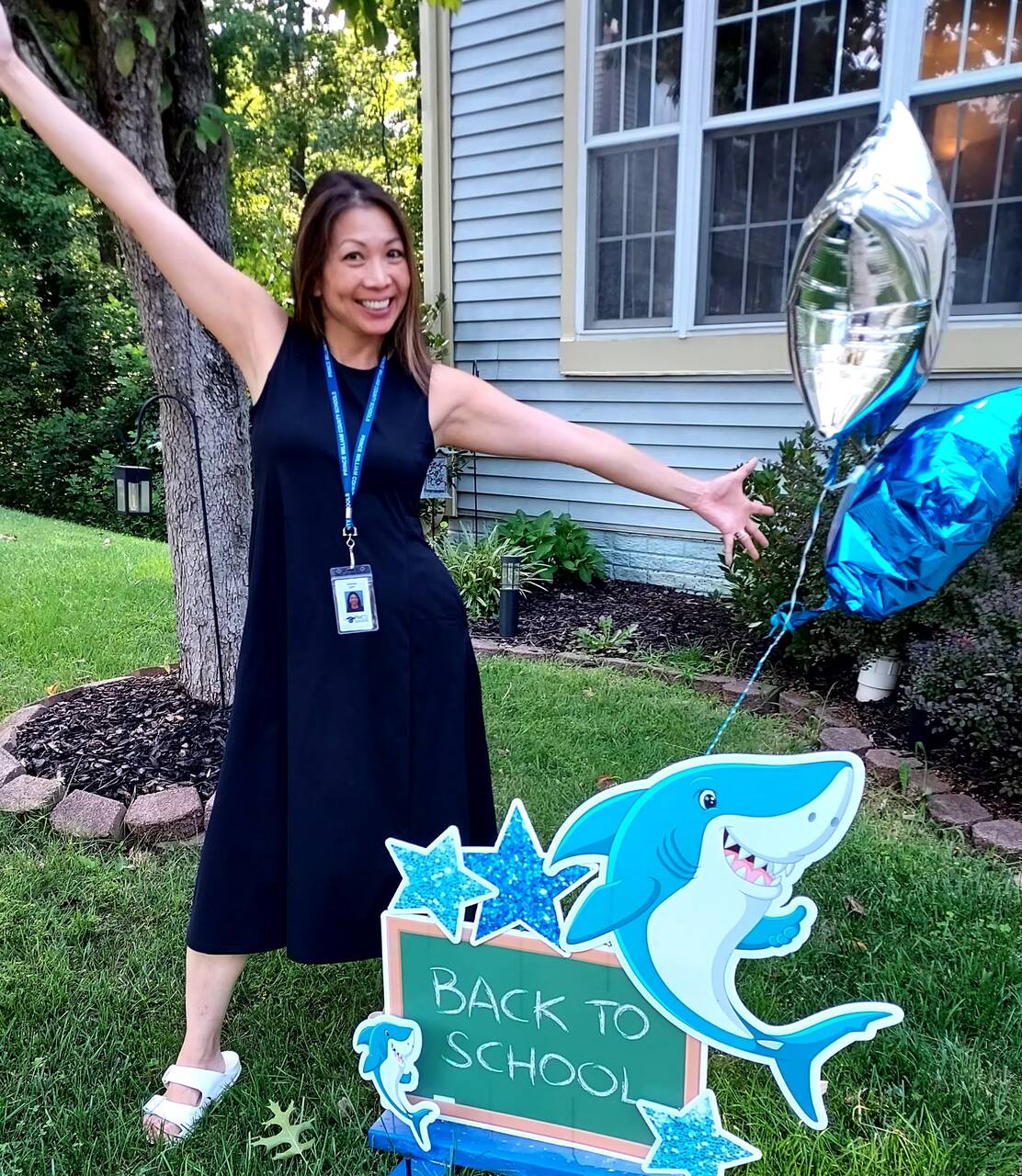 sophia-on-front-yard-with-back-to-school-sign.jpg